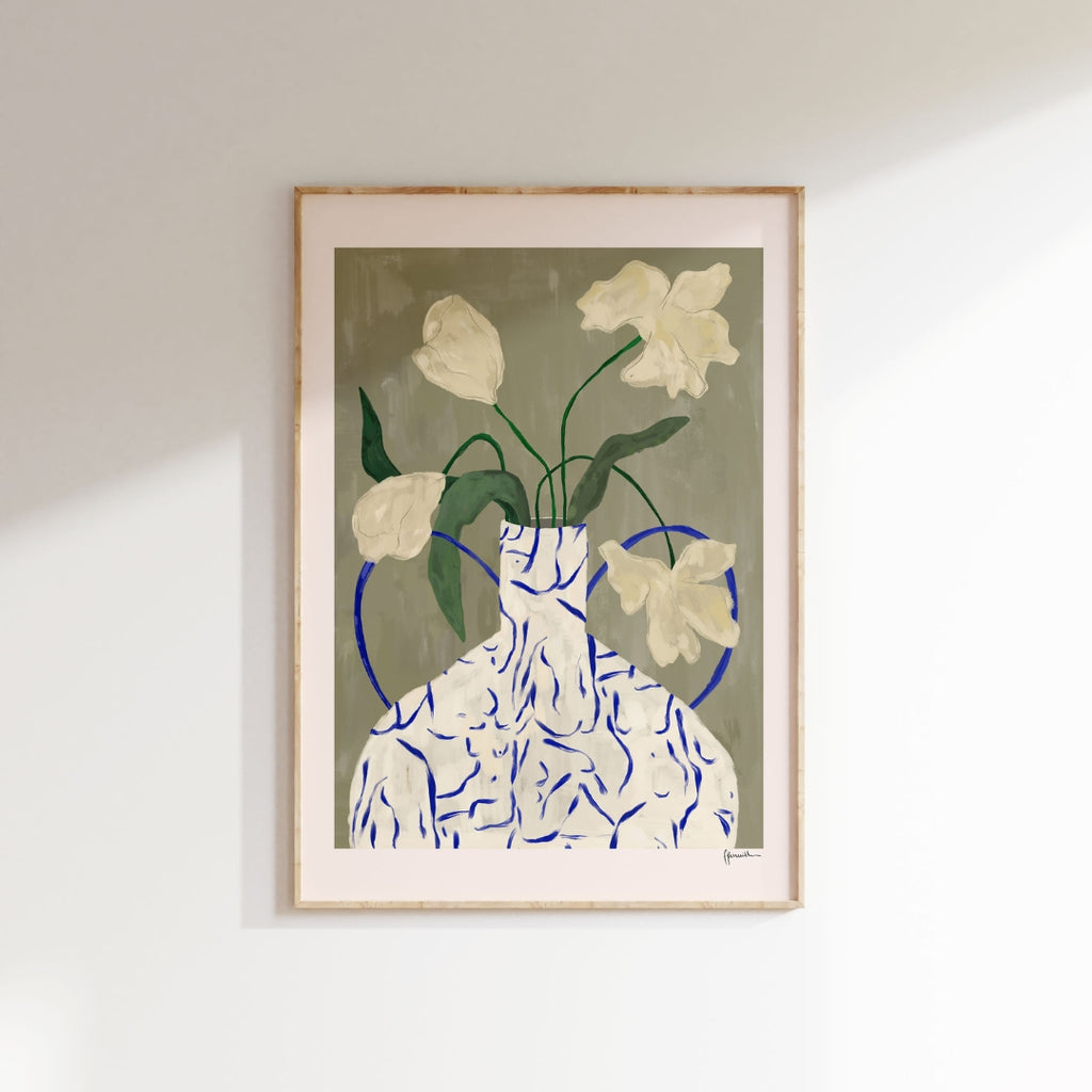 off white flowers in lady vase  Frankie Penwill   Off white flowers in a a white and blue vase. Lady silhouettes in vase. Green gray background. 